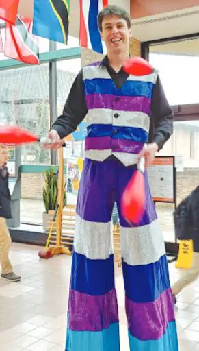 Picture of a man wearing a colourful circus costume